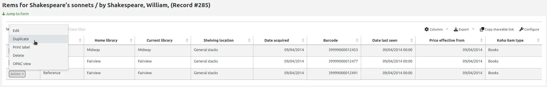 Manage items page, the 'Actions' button next to an item is open and the options are Edit, Duplicate, Print label, Delete, and OPAC view. The mouse cursor is over the Duplicate option.